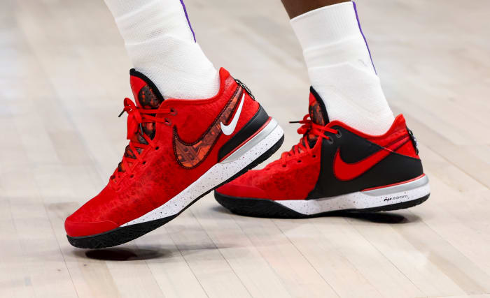 View of LeBron James' red and black Nike shoes.